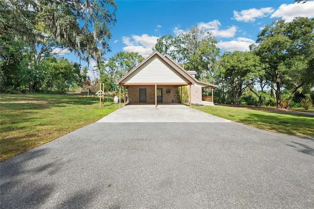 a view of a yard with tree s