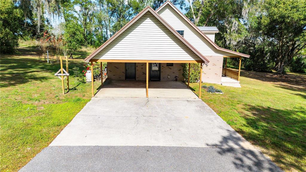 14835 Ramsey Road Dade City, FL 33523 - Photo 54 of 59 a view of house with swimming pool