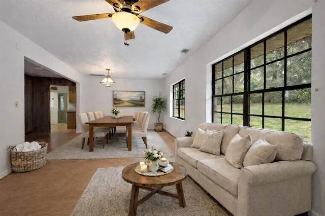 a view of a livingroom with an empty space and a fireplace