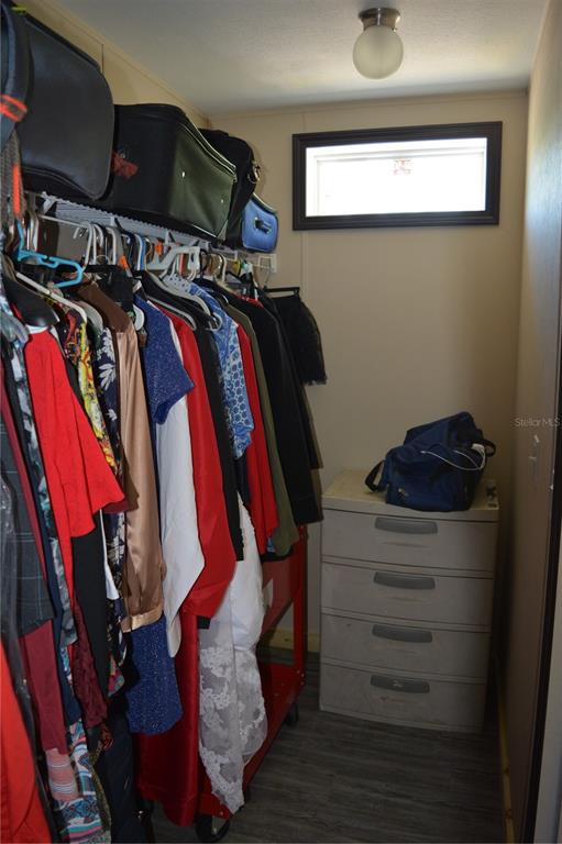 2640 Northeast 74th Street High Springs, FL 32643 - Photo 12 of 39 a view of walk in closet with clothes and shoes