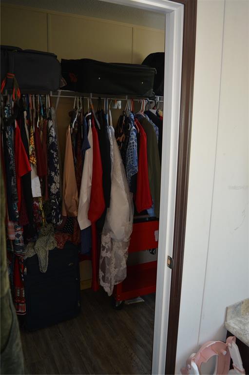 2640 Northeast 74th Street High Springs, FL 32643 - Photo 13 of 39 a view of walk in closet with clothes and shoes
