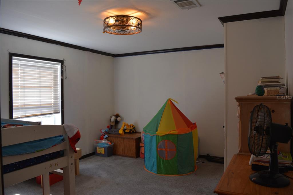 2640 Northeast 74th Street High Springs, FL 32643 - Photo 14 of 39 a view of a room with workspace and a window
