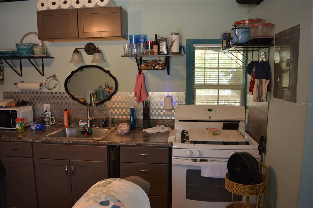 2640 Northeast 74th Street High Springs, FL 32643 - Photo 23 of 39 a kitchen with a sink cabinets and appliances