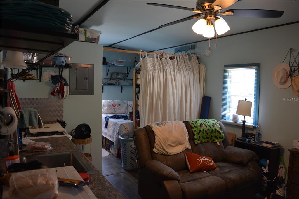 2640 Northeast 74th Street High Springs, FL 32643 - Photo 25 of 39 a living room with furniture and a chandelier