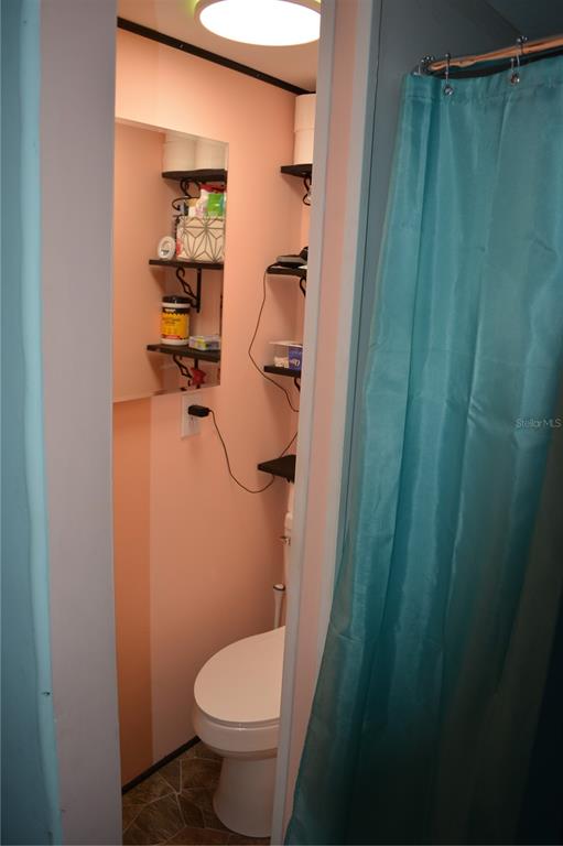 2640 Northeast 74th Street High Springs, FL 32643 - Photo 26 of 39 a bathroom with a toilet and a shower