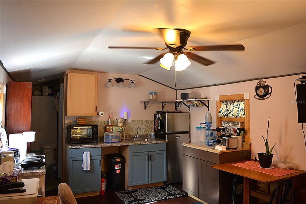 2640 Northeast 74th Street High Springs, FL 32643 - Photo 36 of 39 a kitchen with stainless steel appliances a sink cabinets and refrigerator