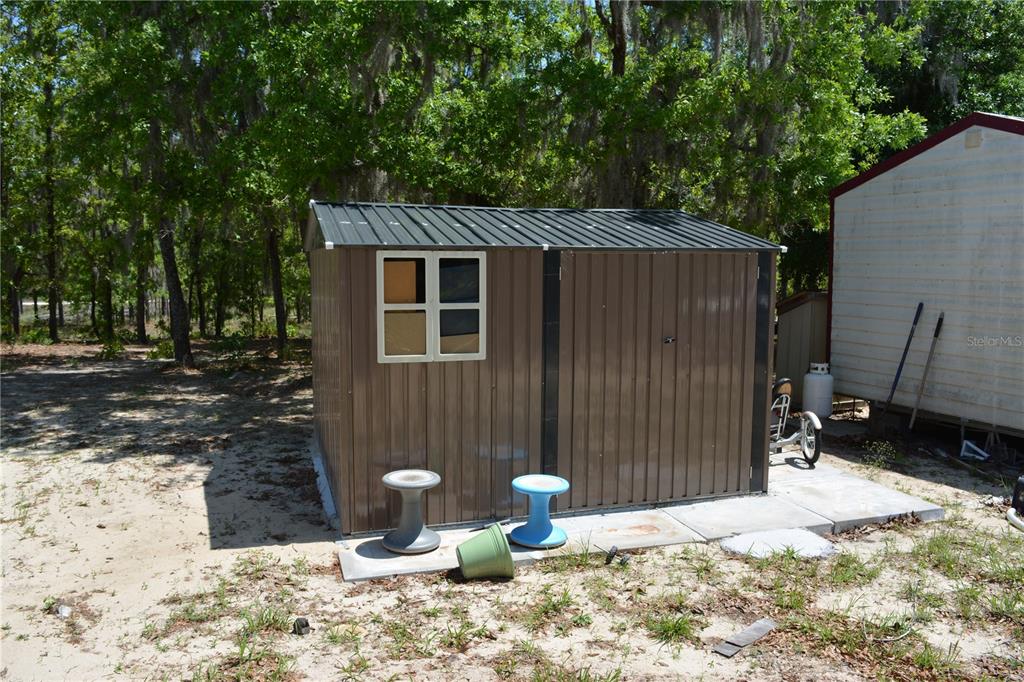 2640 Northeast 74th Street High Springs, FL 32643 - Photo 37 of 39 a backyard of a house with yard and outdoor seating