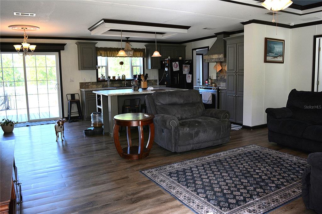 2640 Northeast 74th Street High Springs, FL 32643 - Photo 4 of 39 a living room with furniture and wooden floor