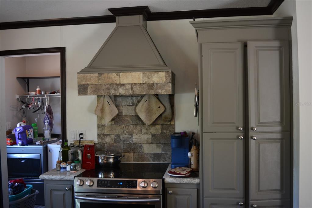 2640 Northeast 74th Street High Springs, FL 32643 - Photo 5 of 39 a room with fireplace and baby