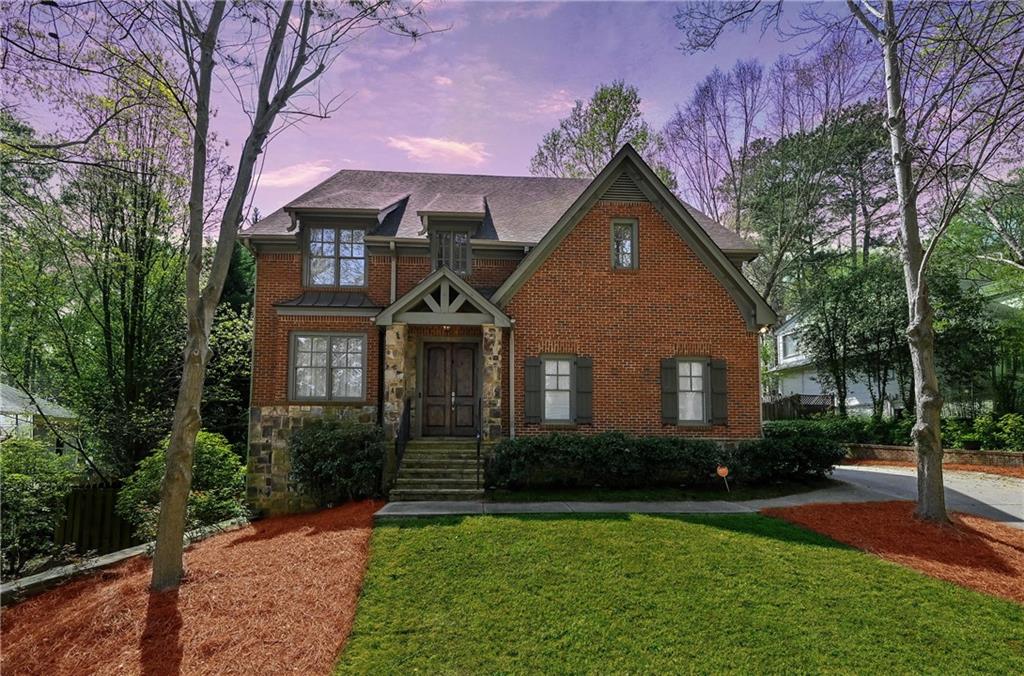 2500 Ridgewood Road Northwest Atlanta, GA 30318 - Photo 1 of 1 a front view of a house with yard and green space