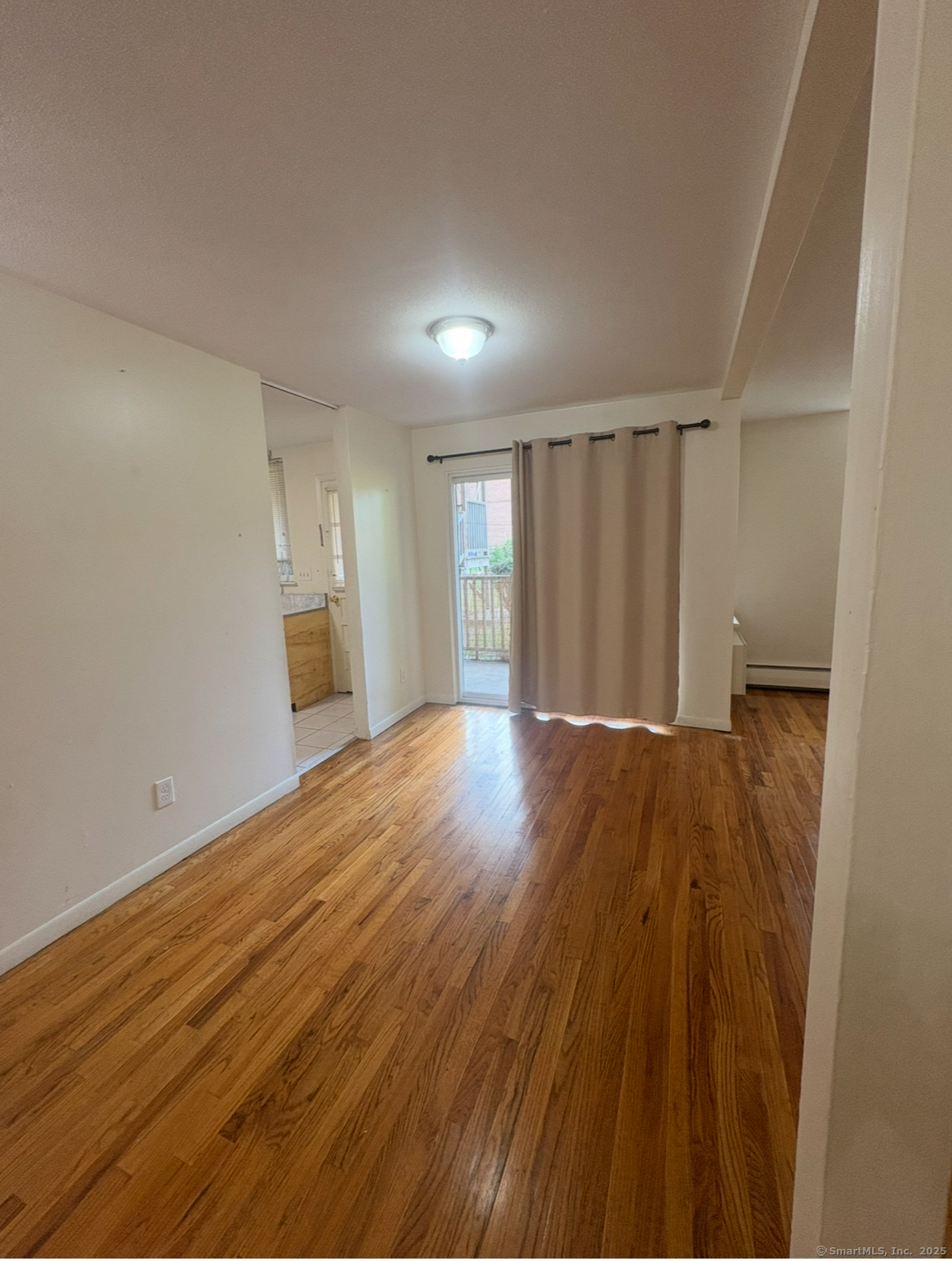492 Fountain Street, Unit 514A2 New Haven, CT 06515 - Photo 2 of 8 a view of empty room with wooden floor