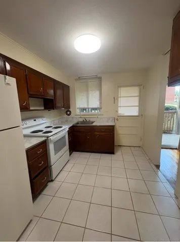 a kitchen with a cabinets and steel appliances