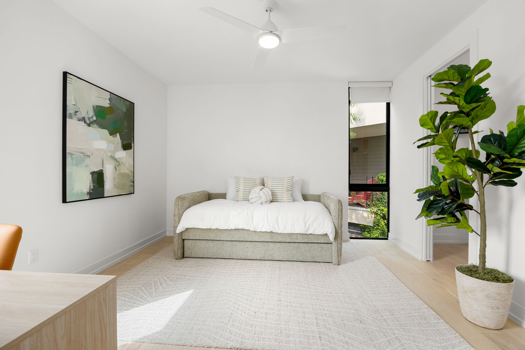 2524 Doc Reeves Street Austin, TX 78723 - Photo 27 of 36 Clean lines and light wood flooring define this versatile secondary bedroom space.