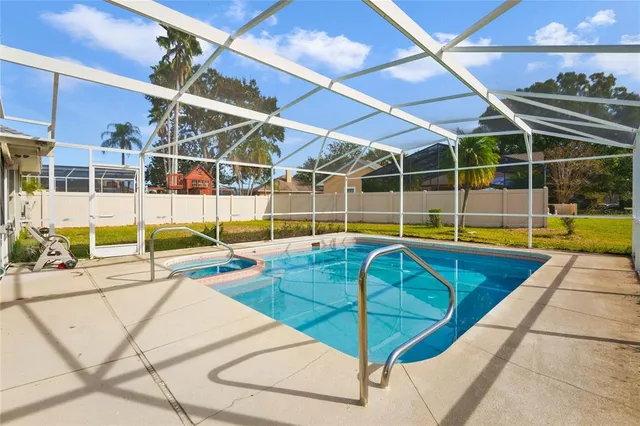 a view of a backyard with table and chairs