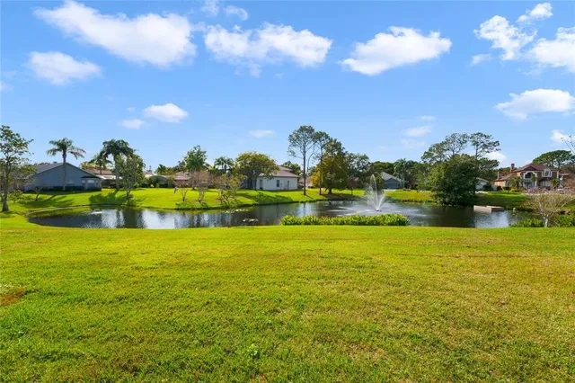 a front view of house with yard and swimming pool