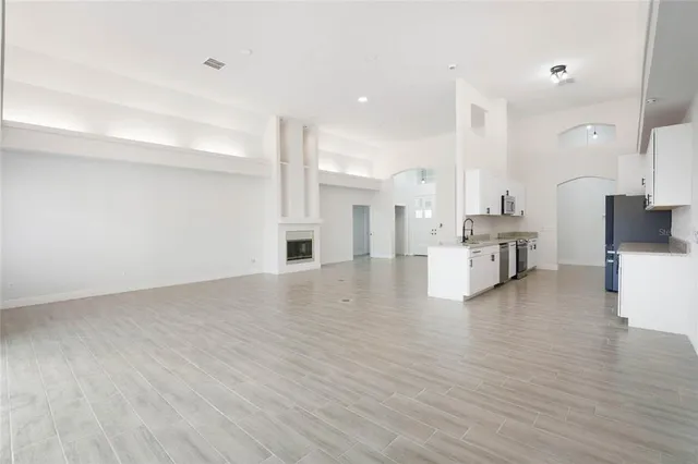 a view of kitchen with furniture and wooden floor
