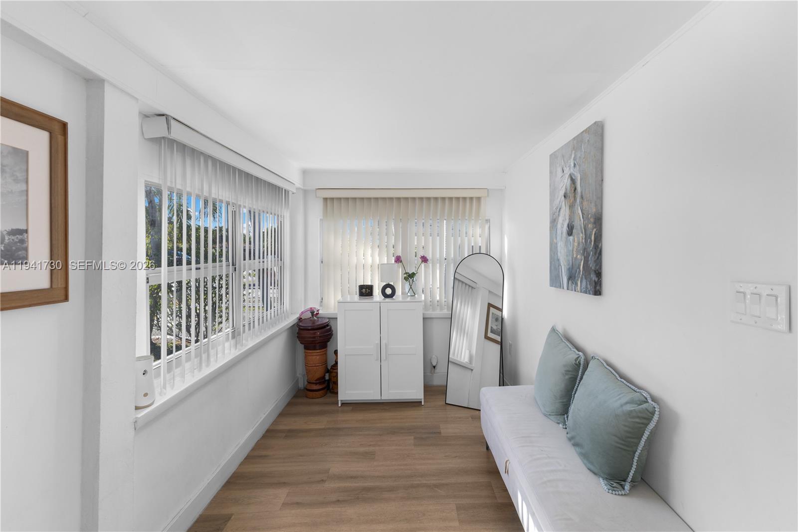 2811 Southwest 17th Street Miami, FL 33145 - Photo 6 of 36 a living room with furniture and a wooden floor