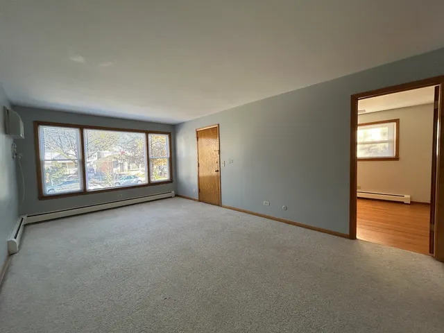 an empty room with windows and view