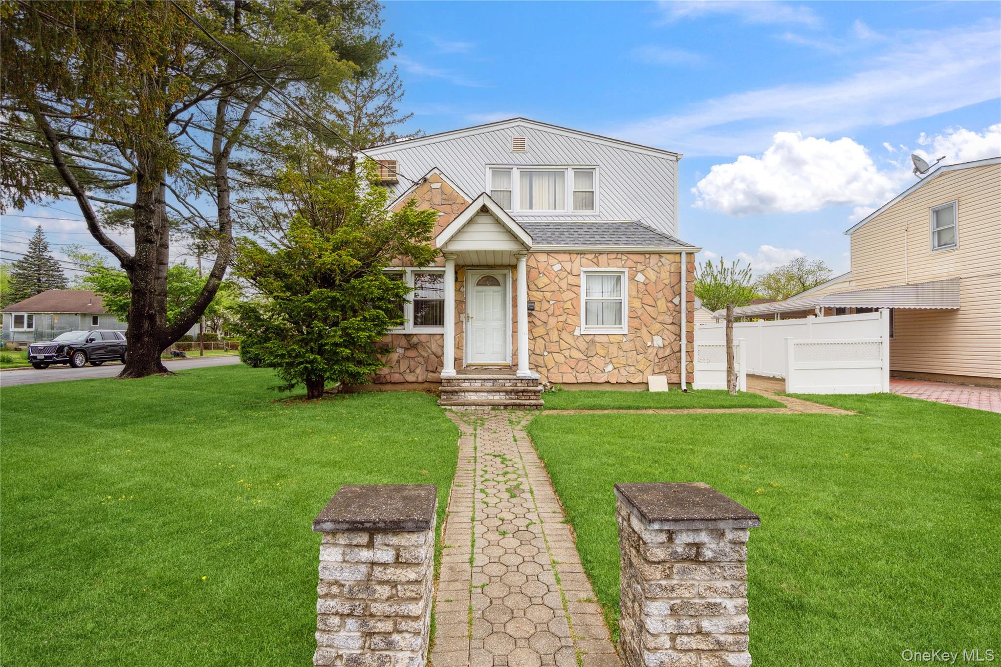 62 Bretton Road New Hyde Park, NY 11040 - Photo 1 of 1 a front view of a house with garden