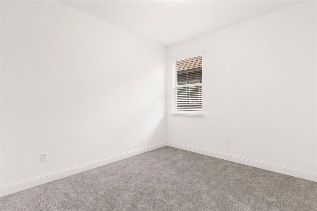 216 Town Pk Avenue Princeton, TX 75407 - Photo 11 of 19 an empty room with a window