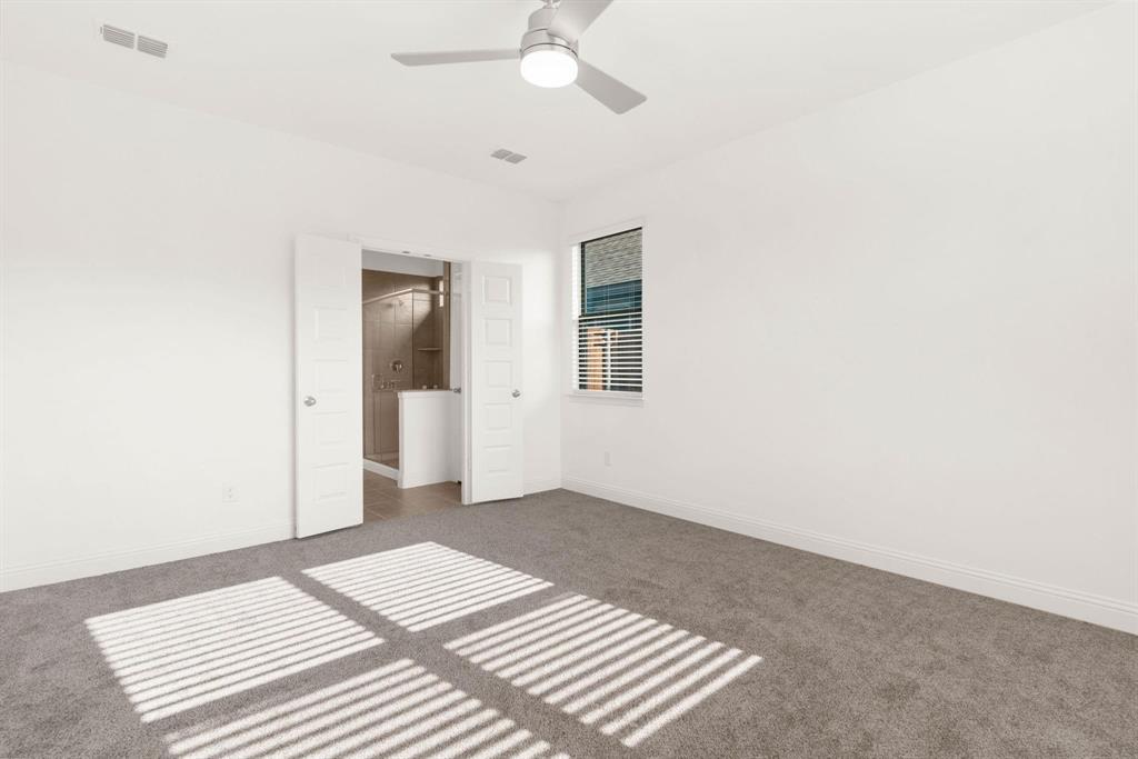 216 Town Pk Avenue Princeton, TX 75407 - Photo 12 of 19 a view of a bedroom with wooden floor and a ceiling fan