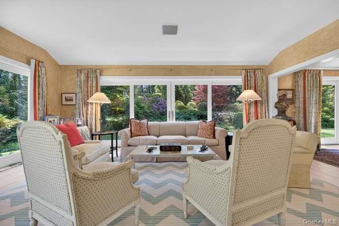 343 Chicken Valley Road Glen Head, NY 11545 - Photo 7 of 49 a living room with furniture and a large window