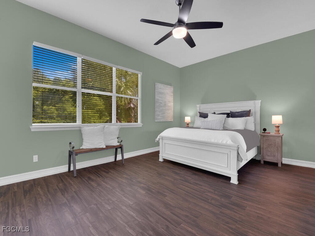 7241 Bergamo Way, Unit 201 Fort Myers, FL 33966 - Photo 12 of 26 a bedroom with a bed and windows