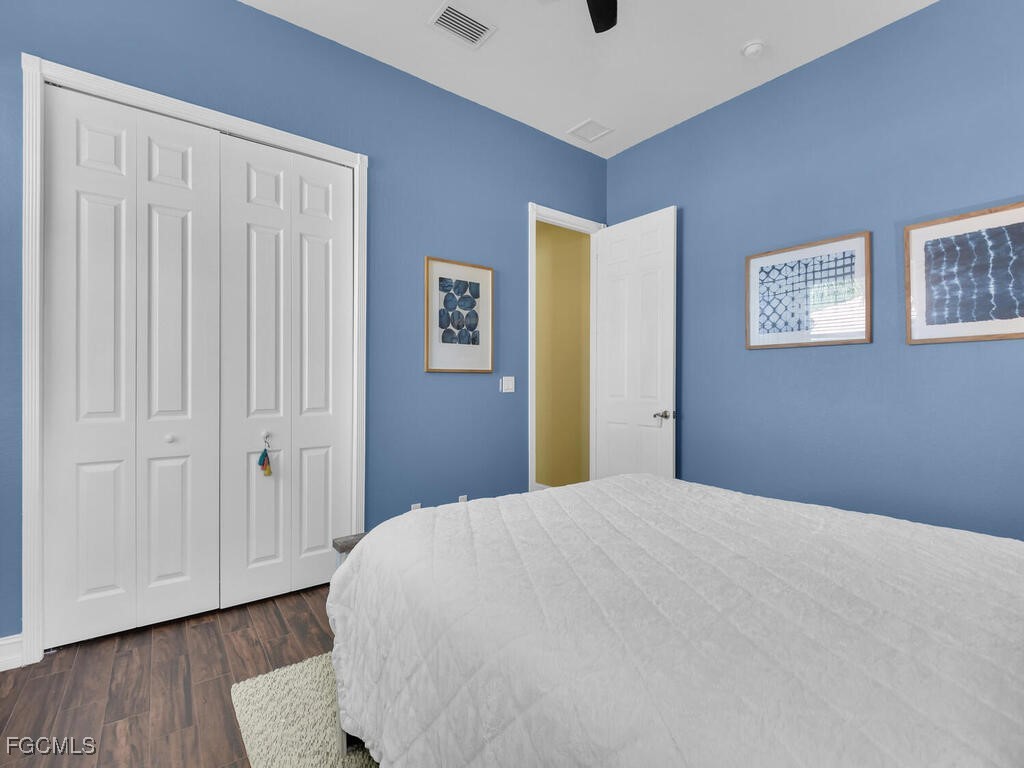 7241 Bergamo Way, Unit 201 Fort Myers, FL 33966 - Photo 16 of 26 a bedroom with a bed and a window