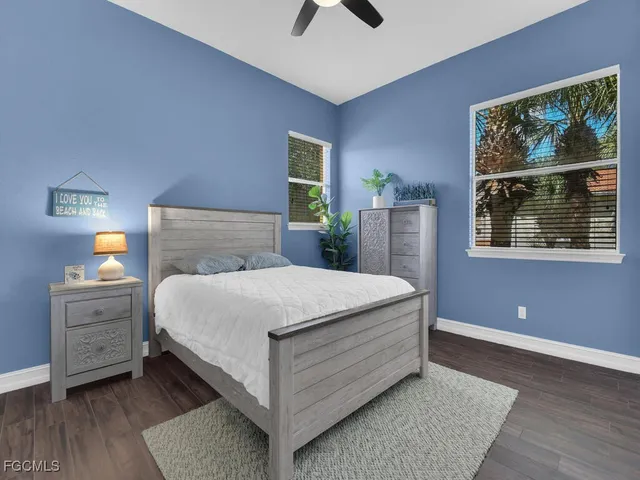 a bed room with a bed and a window