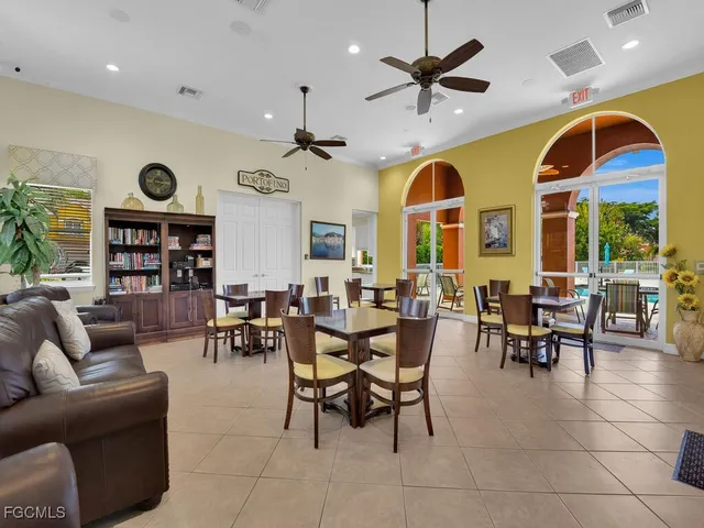 a view of a livingroom with furniture and a large window