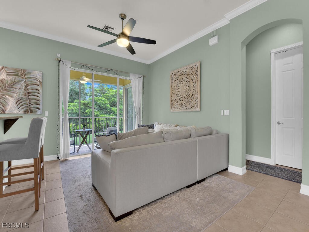 7241 Bergamo Way, Unit 201 Fort Myers, FL 33966 - Photo 3 of 26 a living room with furniture and a large window
