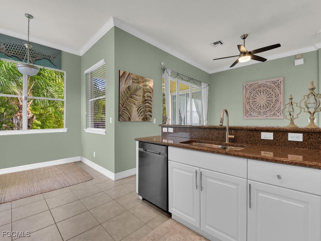 7241 Bergamo Way, Unit 201 Fort Myers, FL 33966 - Photo 5 of 26 a spacious bathroom with a granite countertop sink mirror and window