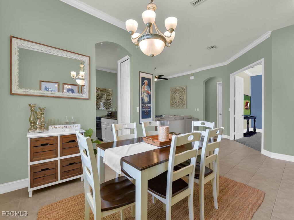 7241 Bergamo Way, Unit 201 Fort Myers, FL 33966 - Photo 10 of 26 a view of a dining room with furniture and wooden floor