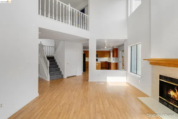 a kitchen with stainless steel appliances a refrigerator and a stove top oven