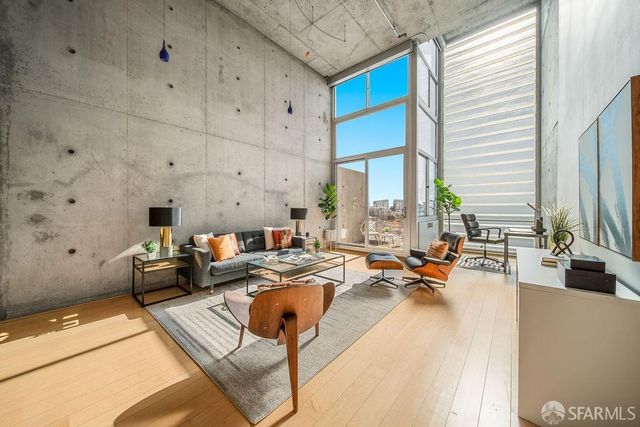 a living room with furniture yard and a window