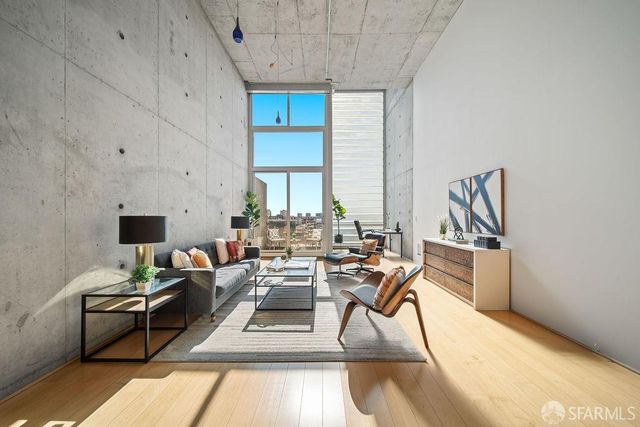 a living room with furniture a rug and a fireplace