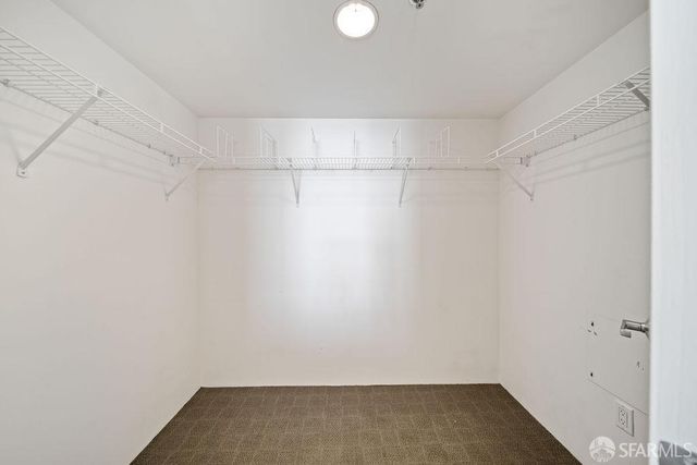 a view of a room with shelf on the wall