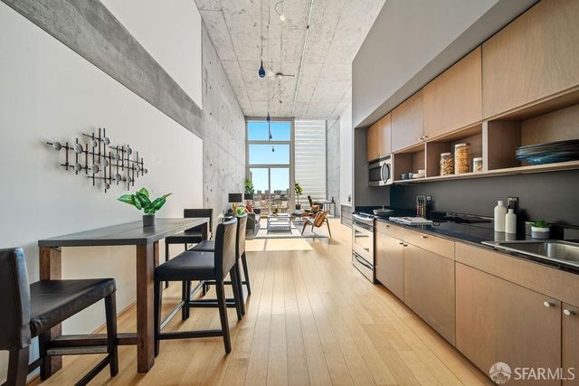 a kitchen with sink cabinets and wooden floor