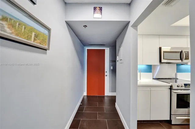 a living room with dining table and a table