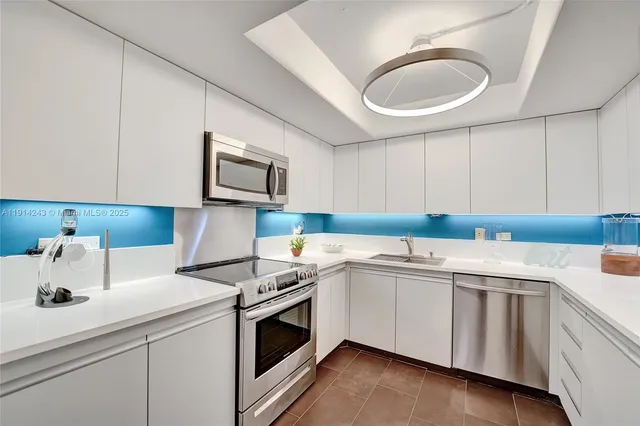 a living room with furniture and a lamp