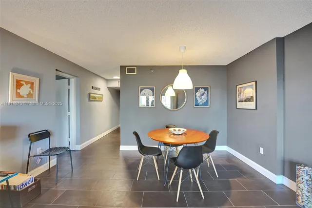 a bedroom with a bed and a chair