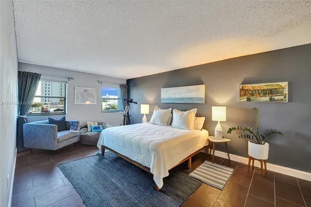 a room with lots of furniture and white walls