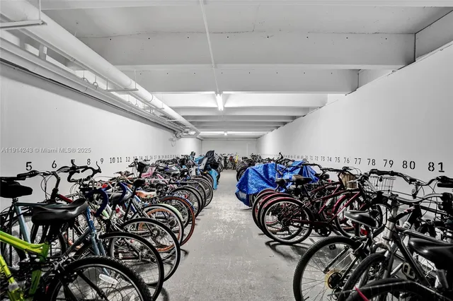 a living room with pool table and a wooden floor