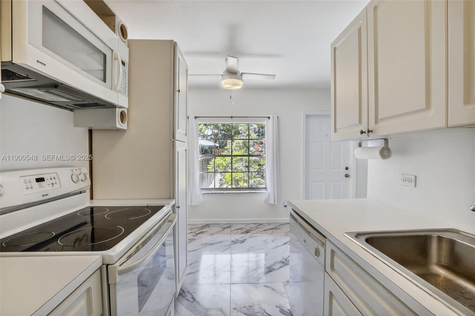 1405 Miami Road, Unit 5 Fort Lauderdale, FL 33316 - Photo 14 of 25 a kitchen that has a sink and a stove