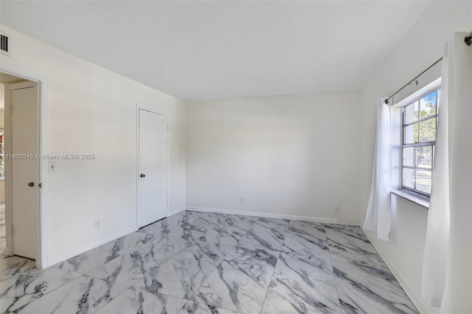1405 Miami Road, Unit 5 Fort Lauderdale, FL 33316 - Photo 14 of 25 a view of empty room with wooden floor