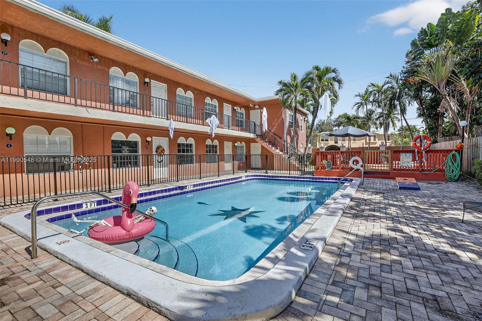1405 Miami Road, Unit 5 Fort Lauderdale, FL 33316 - Photo 20 of 25 a view of a swimming pool with a lounge chairs