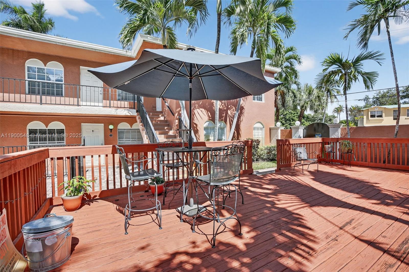 1405 Miami Road, Unit 5 Fort Lauderdale, FL 33316 - Photo 22 of 25 a view of a chair and tables in the patio