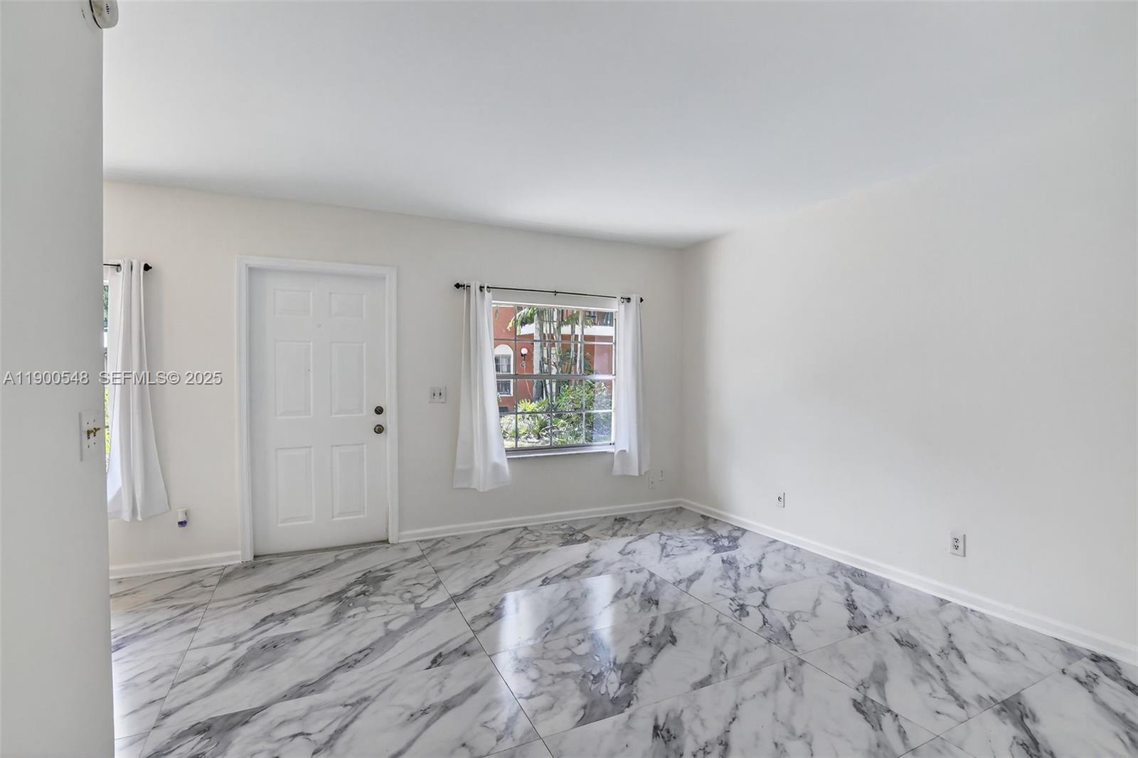 1405 Miami Road, Unit 5 Fort Lauderdale, FL 33316 - Photo 8 of 25 a view of empty room with window