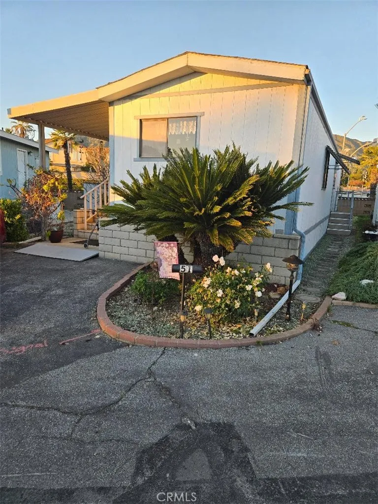 a view of a fountain in front of a house