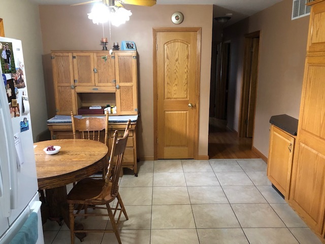 1065 North 3rd Street Rochelle, IL 61068 - Photo 6 of 17 a kitchen with a table and chairs